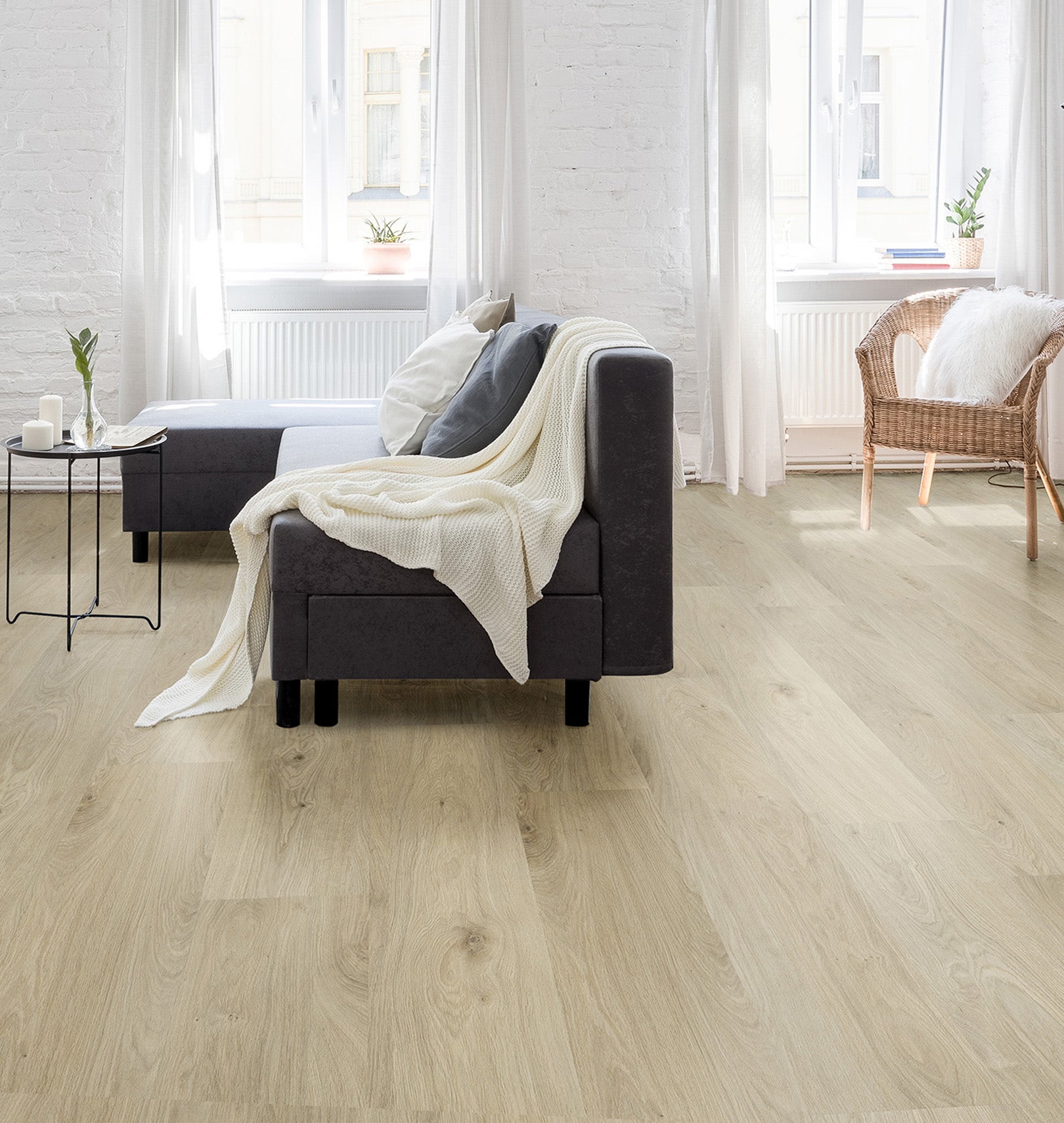 Living room featuring Harmony Linen Oak water-resistant laminate flooring with textured finish, complemented by modern furniture and neutral decor.