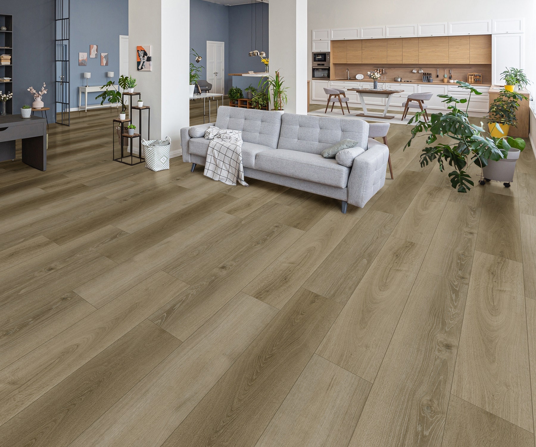 Ava Stone Oak SPC Core hybrid flooring in a spacious, contemporary living and dining area Modern open-plan living space featuring Ava Stone Oak SPC Core hybrid flooring with a grey couch and kitchen in the background