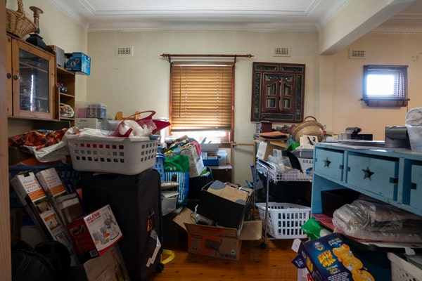 A dark lounge full of clutter
