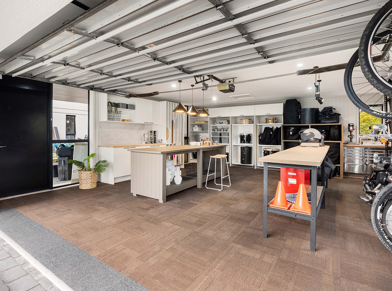 Renovated garage after the space invarders team made of the space a functional oasis