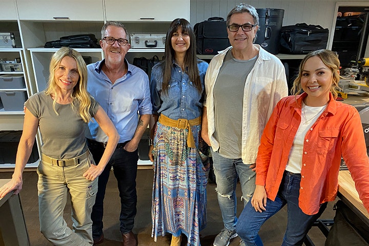 Space Invaders' cast with Jo & Efrem smiling in their renovated garage 