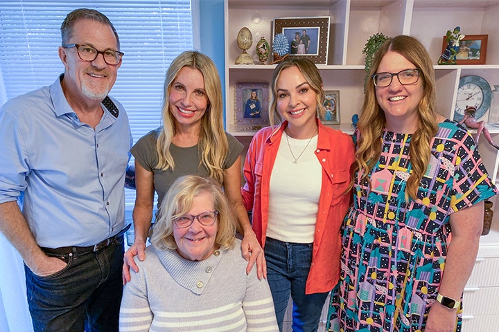 Space Invaders' cast with Sandra & Denise smiling in their renovated house