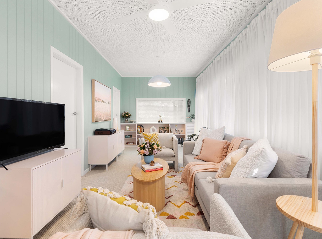 a renovated pastel coloured bright living room in Sandra's house