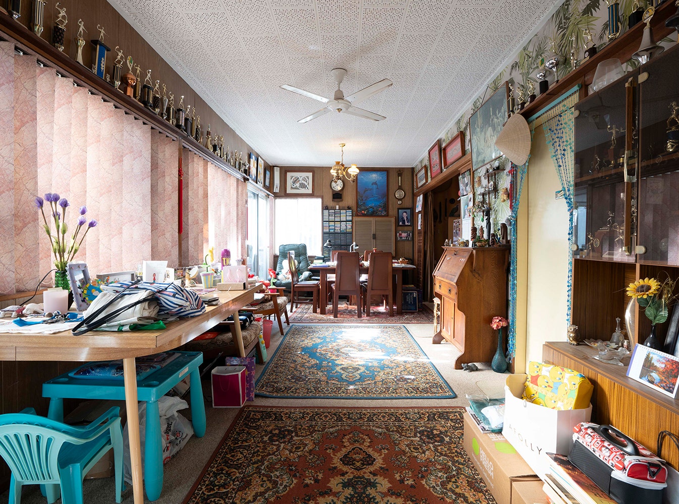 before photo of the livingroom full with stuff, brown, old and dark