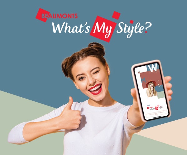 Girl with a thumb up and one phone in the other showing Beaumont Tiles What's my Style Quiz