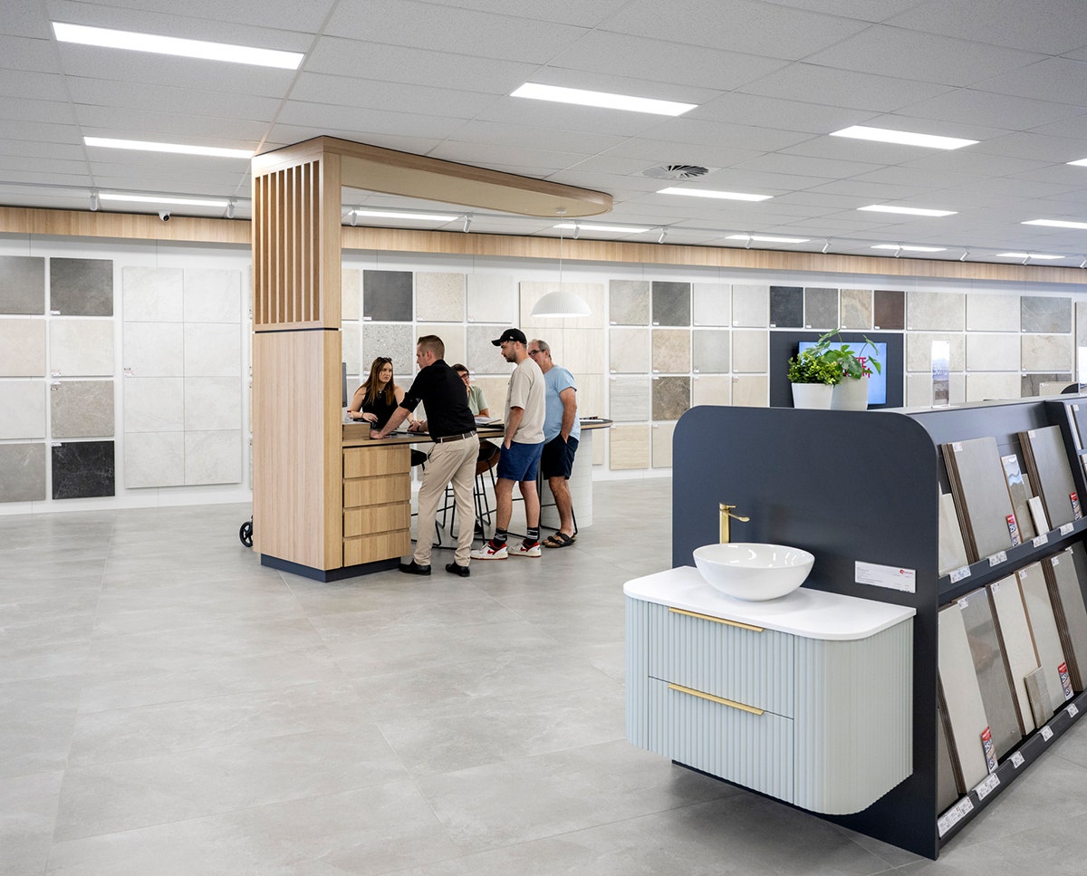 A Beaumont Tiles showroom and a family group getting a free design consultation