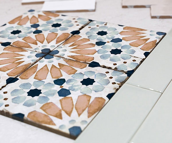 Eye-catching Geometric Patterned Decorative Tile in Orange and Blue, Displayed with White Tiles for Free Full-Size Samples Promotion